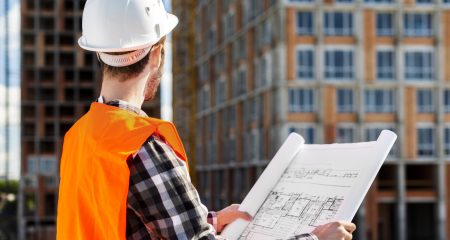 medium-shot-side-view-engineer-holding-plans medium-shot-side-view-engineer-holding-plans