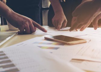 Vintage style photo of business working group of people are disc Vintage style photo of business working group of people are discussing together